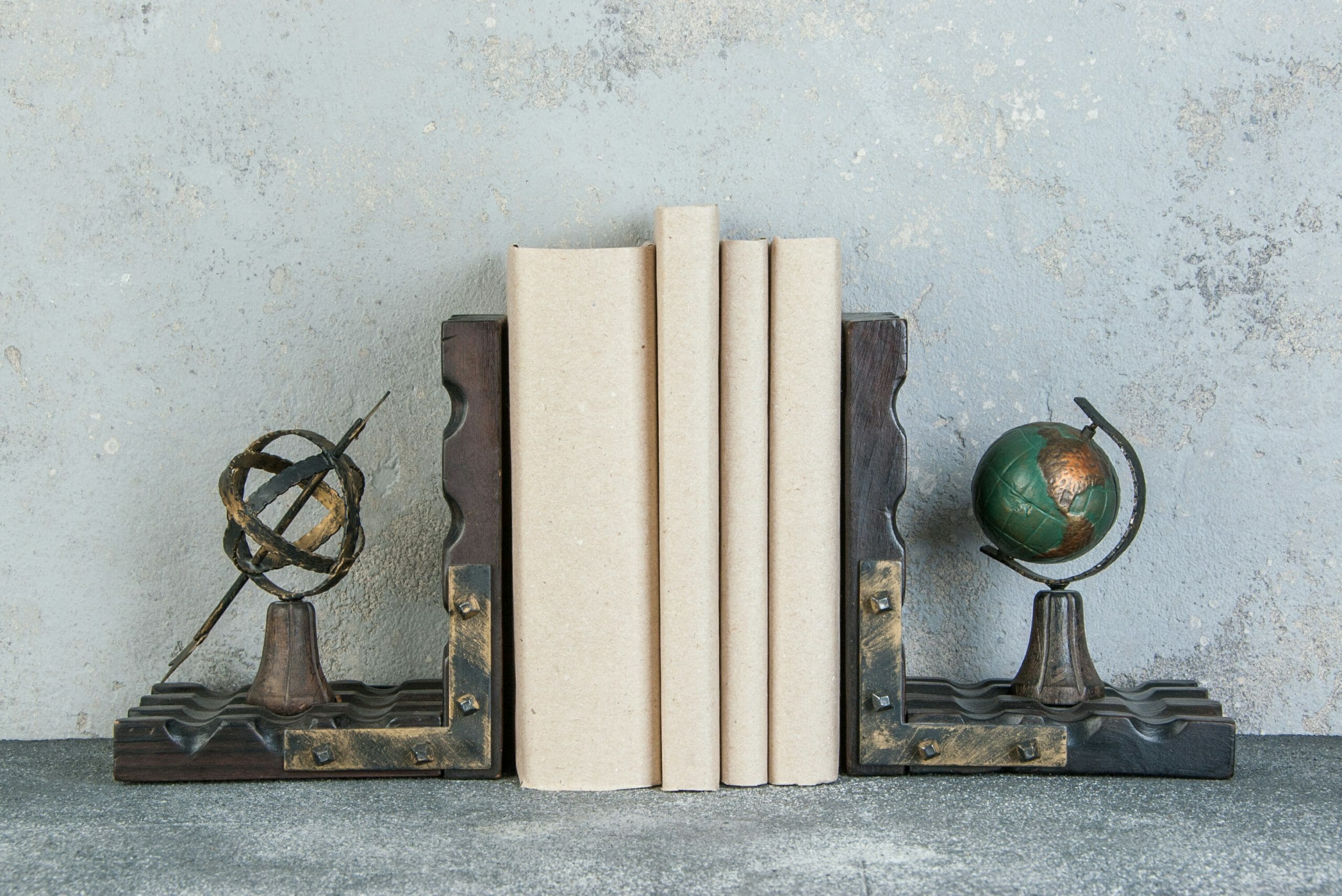 Antique book ends on a gray background